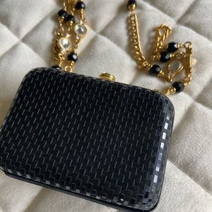Evening bag, gold chain with crystals.